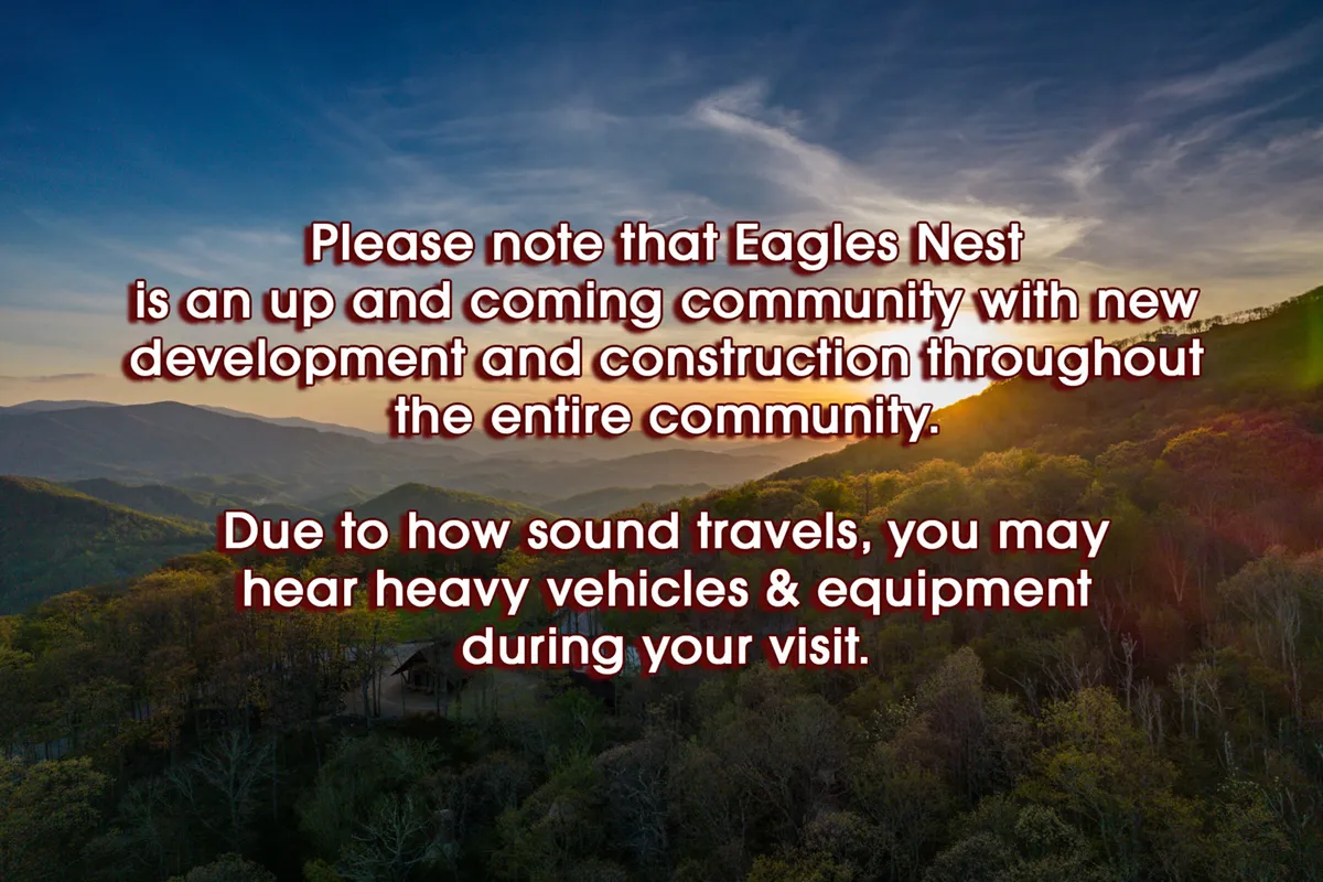 A sweeping view of a mountainous landscape at sunset, with the sky painted in rich hues and dense greenery stretching towards the horizon. The serene, dramatic backdrop evokes the stunning natural environment surrounding the property, emphasizing the proximity to Grandfather and Sugar Mountains.